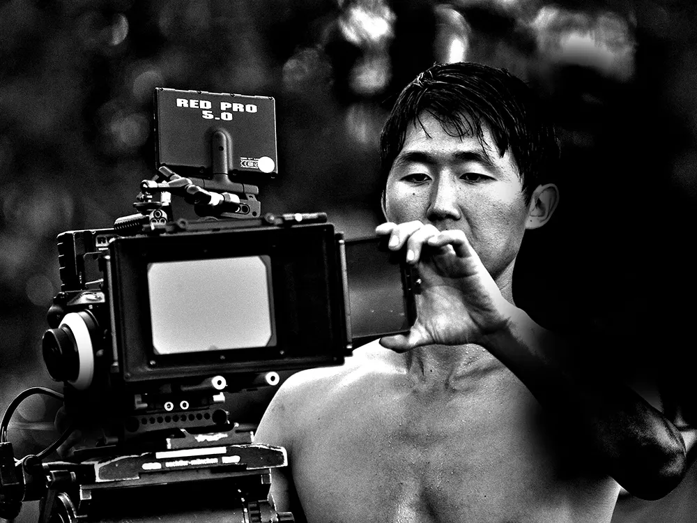 Jade Warpenburg, director of photography for Transolar Galactica, sets up the camera for the next scene. - YOUNG KWAK