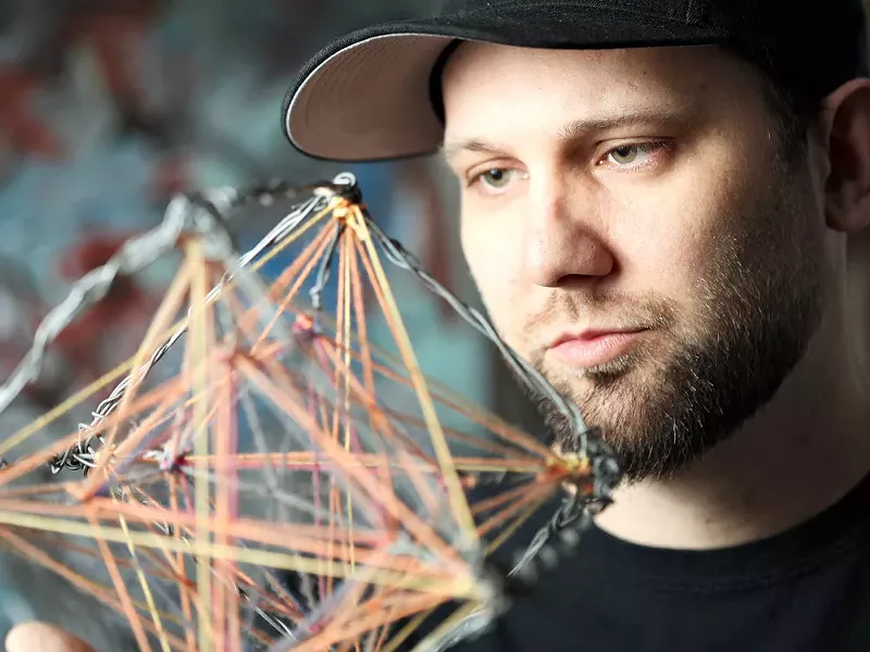 Jason Corcoran holds an untitled Metatron\'s cube. - YOUNG KWAK