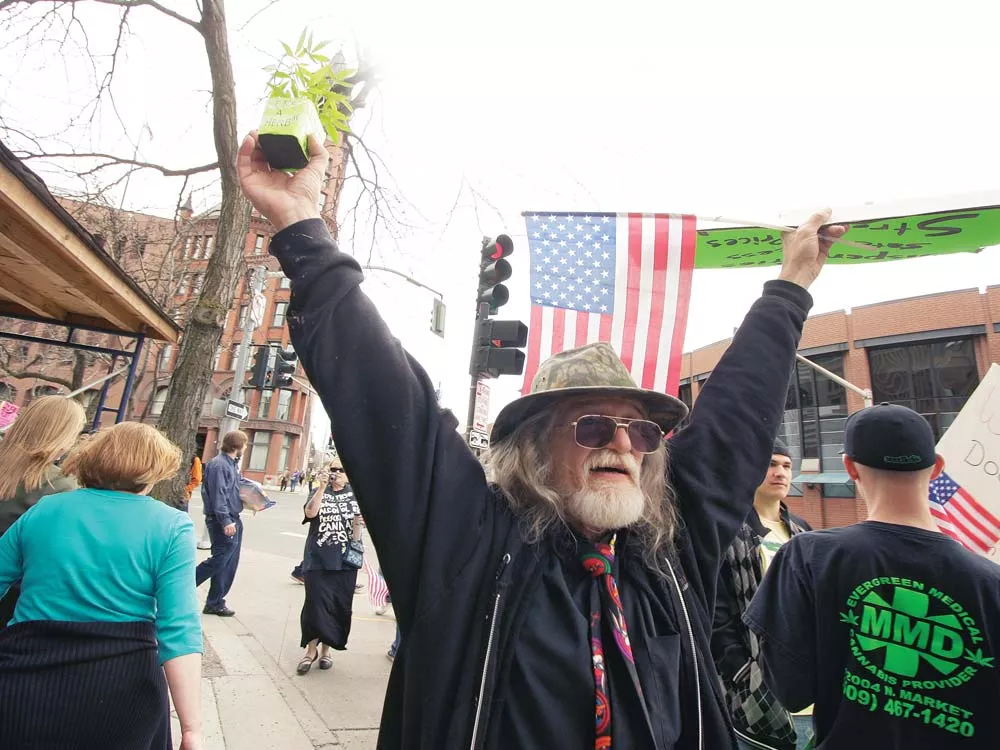 Jerry Laberdee during a protest against last week's raids in front of Spokane's federal courthouse. - YOUNG KWAK