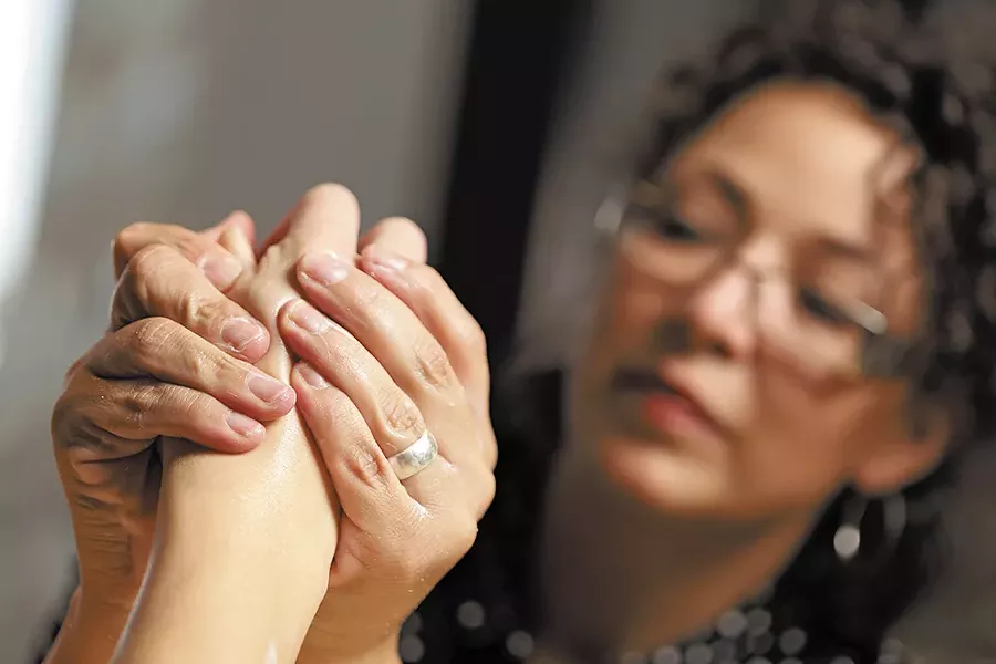 Jill Turner, salon trainer at The Spa Coeur d'Alene, helps clients combat winter ravages on their hands. - YOUNG KWAK