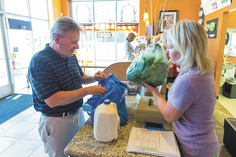 John Christman is Shelly Stevens "number one customer." Christman buys fresh produce, meats and eggs from Stevens every week. - MATT WEIGAND