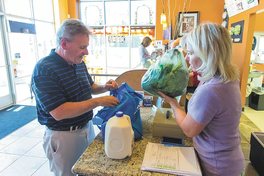 John Christman is Shelly Stevens "number one customer." Christman buys fresh produce, meats and eggs from Stevens every week. - MATT WEIGAND