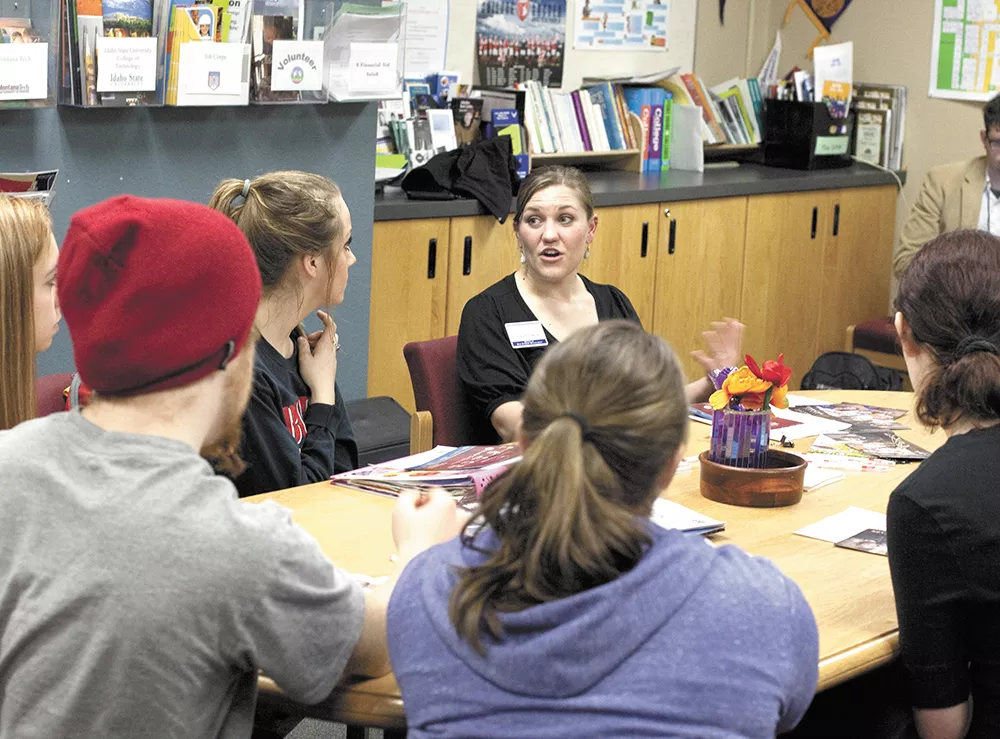 Justene Garner, from Lewis-Clark State College, walks Sandpoint High students through the list of things they need to enroll in college. - ANNIE KUSTER