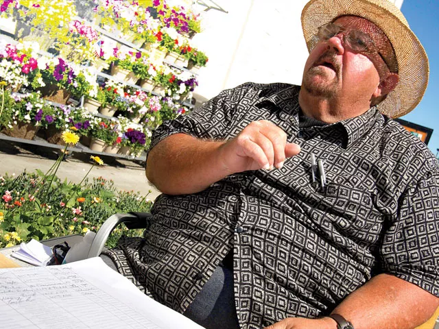 Keith Saunders, a paid signature-gatherer, stops shoppers outside a Fred Meyer in Spokane last weekend. - YOUNG KWAK
