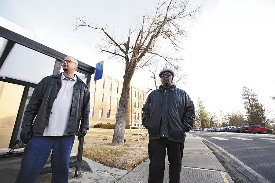 Ketema Ross, left, and David "DB" Brent wait for a bus near Eastern State Hospital in January, after receiving court permission to attend Narcotics Anonymous meetings in downtown Spokane. - YOUNG KWAK