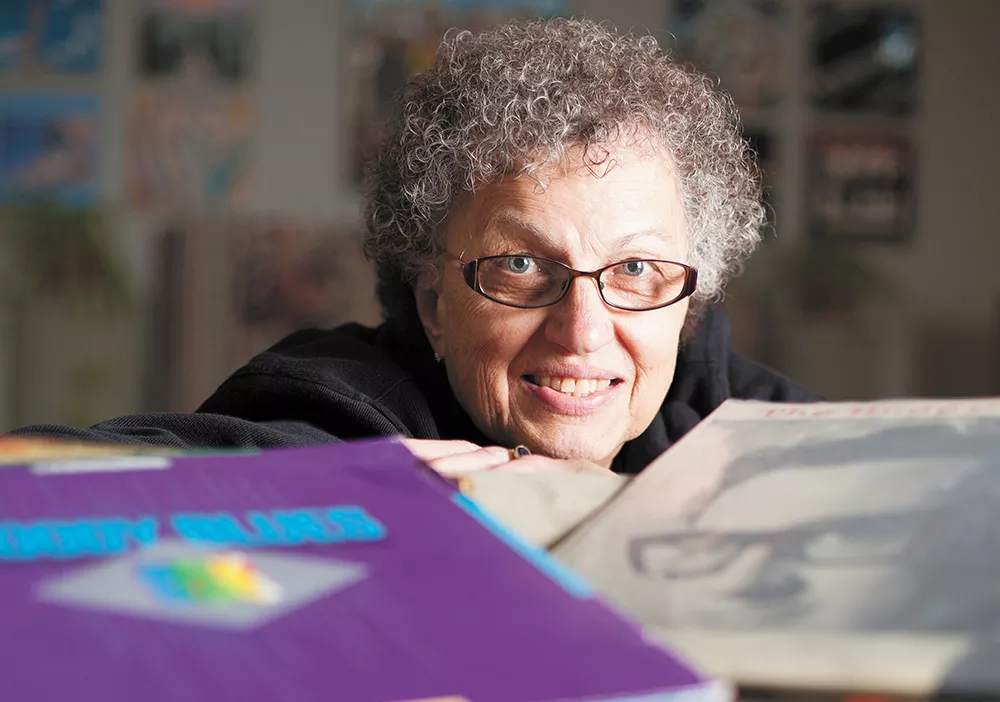 Laura Skaer poses with part of her estimated 2,000-strong record collection, which includes her first record, The Buddy Holly Story, purchased in 1959. - YOUNG KWAK