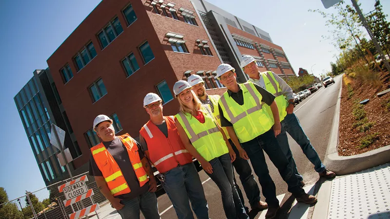 (Left to right) Bob Cross, Carl Clausen, Karlee Agee, Scott McGlocklin, Regie Brusell and Bob Askins stand in front of the new WSU BioMed building that they helped create. - JENNIFER DEBARROS
