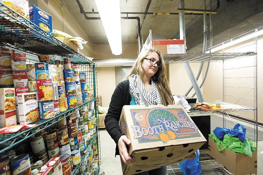 Lewis and Clark High School senior Danielle Aranda works at the school's Tiger Food Pantry for course credit. - YOUNG KWAK