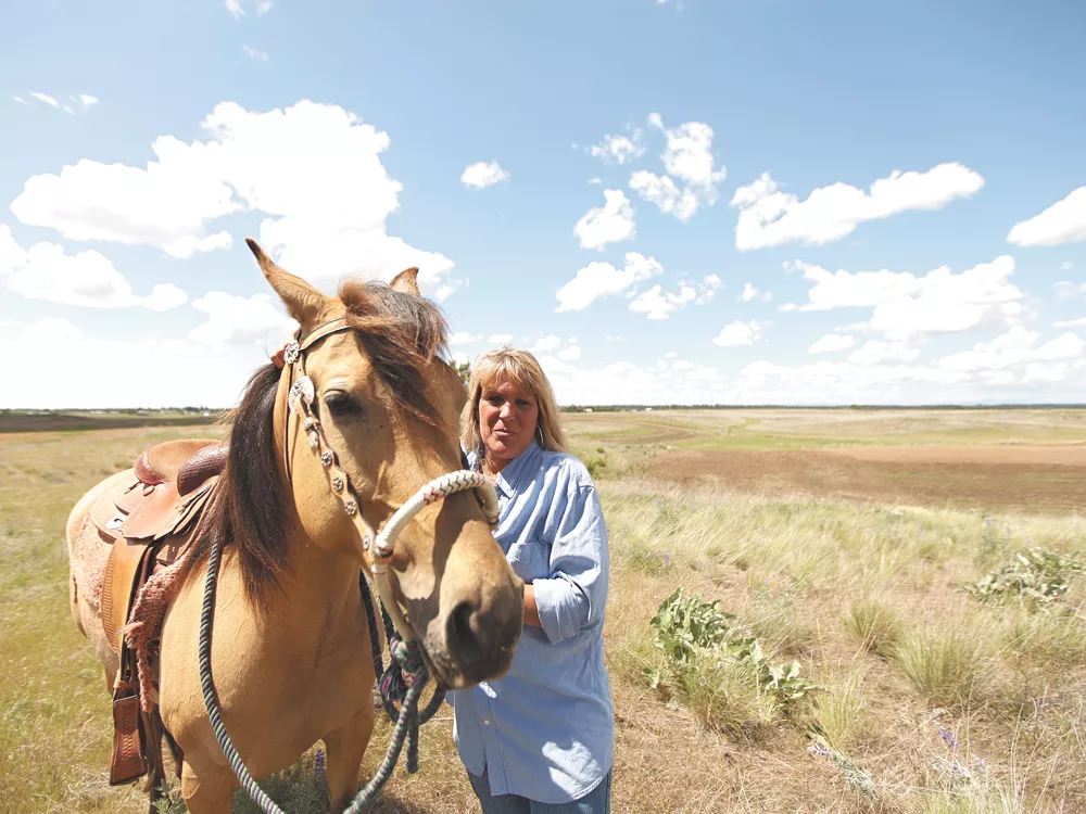 Lisa Long bought land across from Fairchild Air Force Base 15 years ago and has watched her community boom with development. - YOUNG KWAK