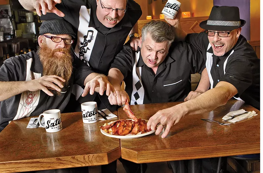 Local blues act Bakin' Phat (from left: Pat Potter, Ken Danielson, Dennis Higgins and Dave Allen) fight over strips of bacon at Satellite Diner & Lounge. - CHAD RAMSEY