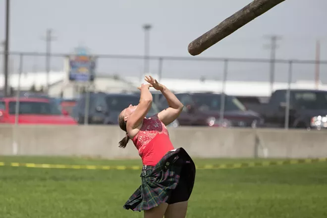 Maisie Walters, from Everett, Wash., tosses a caber during the women's amateur A & B competition. - YOUNG KWAK