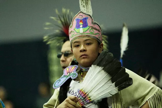 Marisa Shottanana-Ponce, of the Kootenai Tribe of Idaho, walks in the opening procession. - YOUNG KWAK