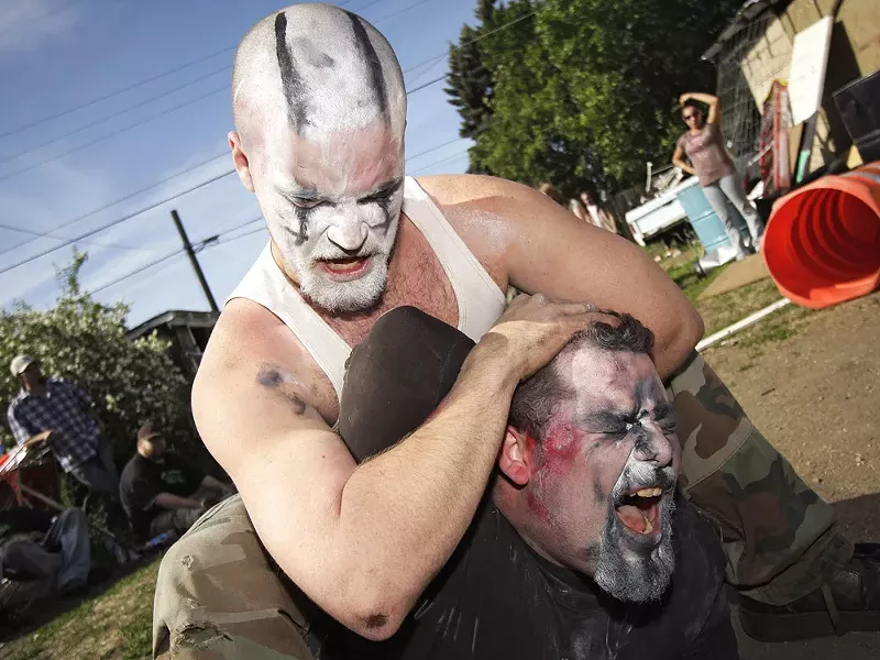 Master Mayhem puts King Chaos in a headlock. - YOUNG KWAK