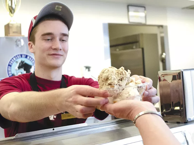 Matt Turley serves up locally produced ice cream at a Pullman institution. - JACOB JONES