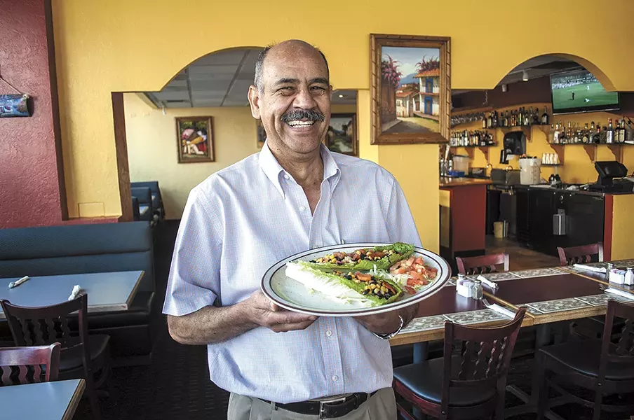 Mi Casa owner Luis Perez with his lettuce tacos. - SARAH WURTZ