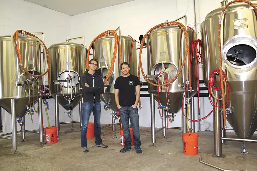 MickDuff's co-owners Mickey (left) and Duffy Mahoney with their new brewing equipment.