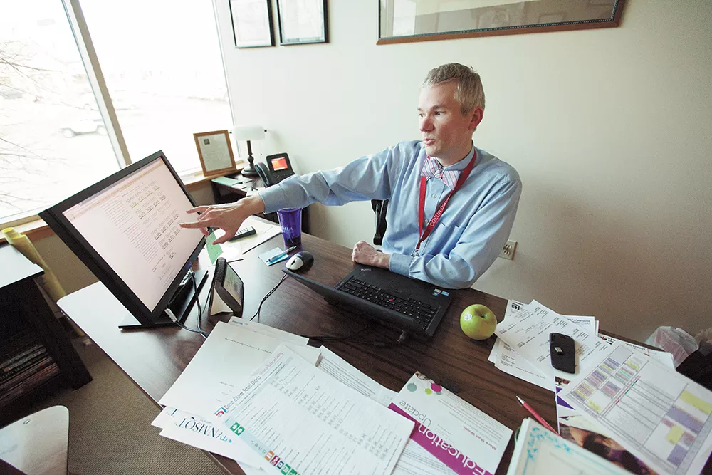 Mike Nelson, the Coeur d'Alene School District's director of curriculum and assessment, points to Schoolnet, an educational software system that still hasn't delivered on its big promises. - YOUNG KWAK