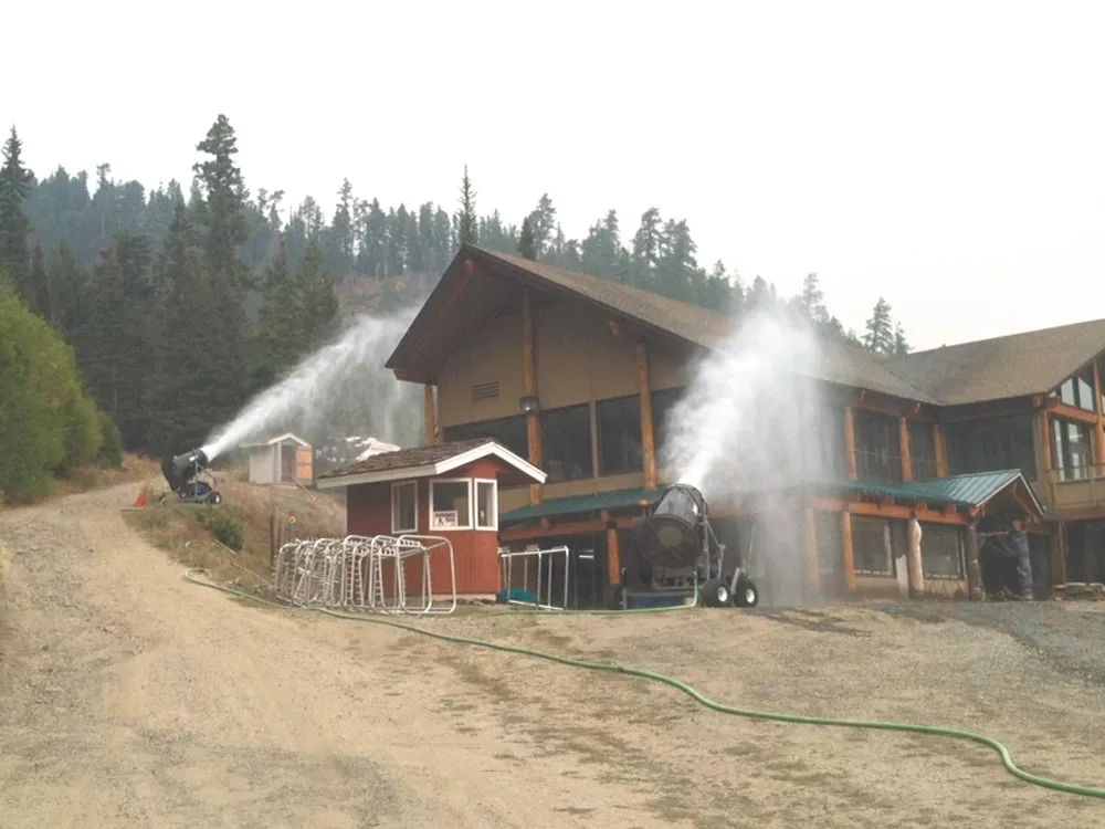 Mission Ridge staff trained their snowmaking guns on the lodge to keep it from burning. - JOSH JORGENSEN