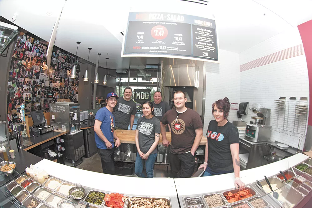 Mod Pizza general manager Michael Sherman (top center) with his employees at the new South Hill shop. - MEGHAN KIRK