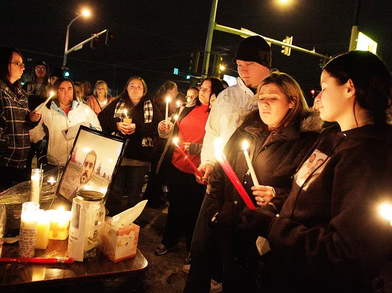 Mourners gather at the candlelight vigil for Jeremy Groom, who was shot by Spokane Police. - YOUNG KWAK