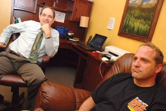 Myron Thurber (left) of Neurotherapy Northwest helps a patient modulate his brain waves. Results in treating anxiety and depression, Thurber says, can be remarkable. - TAMMY MARSHALL