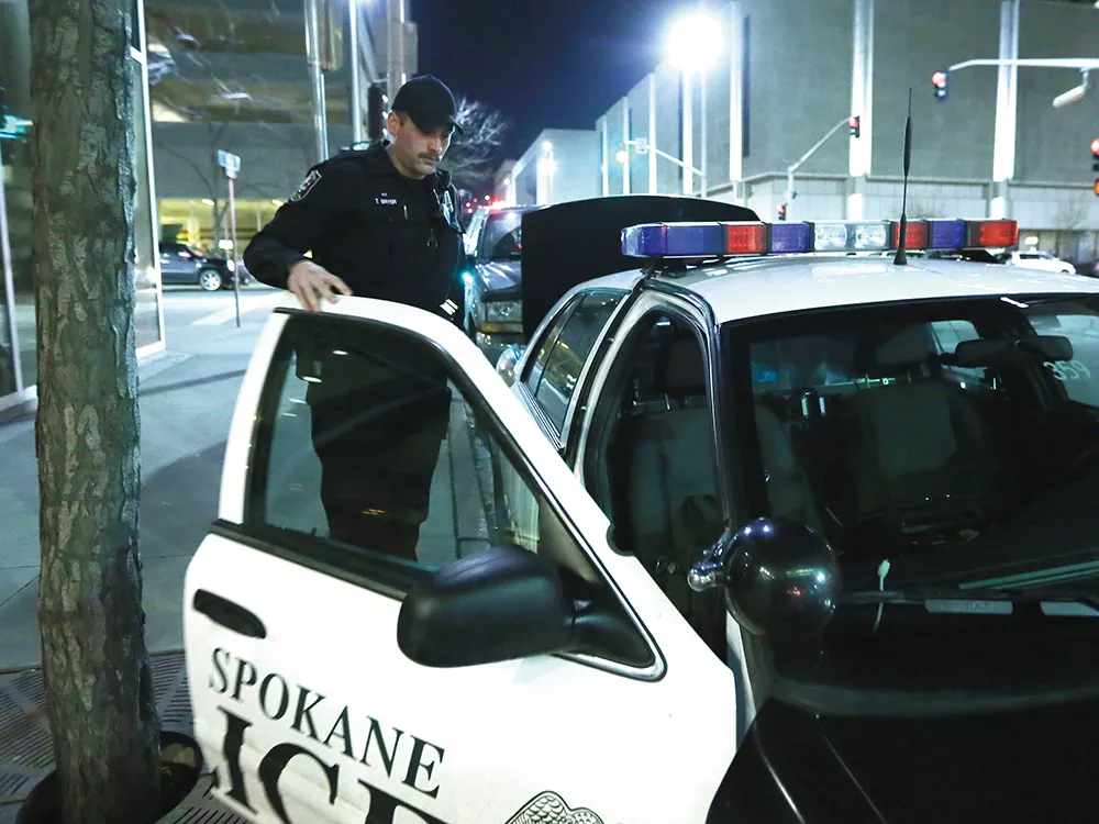 Neighborhood Conditions Officer Toby Bryer works the downtown Spokane area as part of a newly introduced community policing model. - YOUNG KWAK