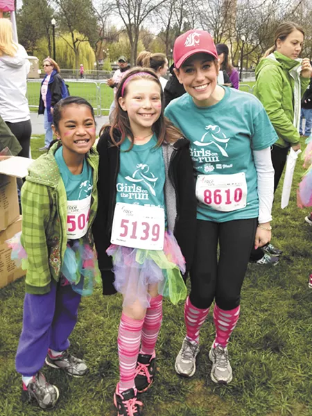 Neshyia and Sarah stop for a picture with their running buddy, Gale Bevington.