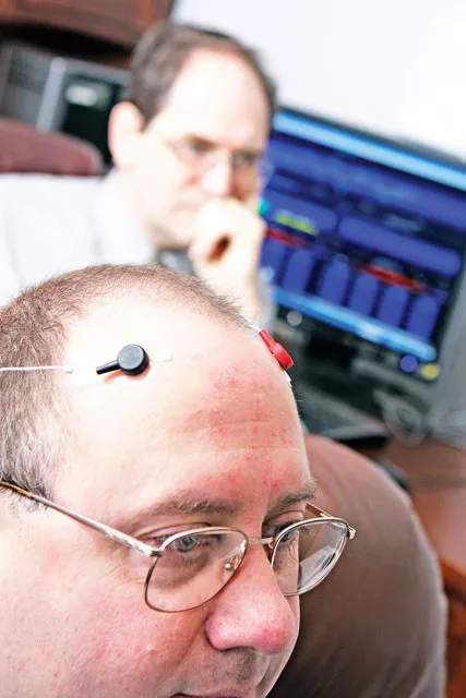 Neurotherapy Northwests Dr. Myron Thurber (top) demonstrates a session at his office in Spokane Valley. - YOUNG KWAK