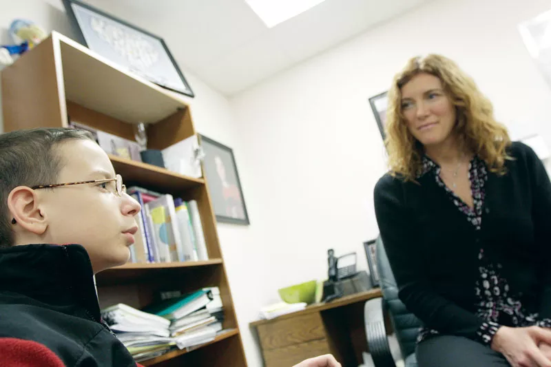 Northwest Autism Center Executive Director Dawn Sidell with 12-year-old J.J. Clardy, who was diagnosed with Aspergers — a form of autism — four years ago. - YOUNG KWAK