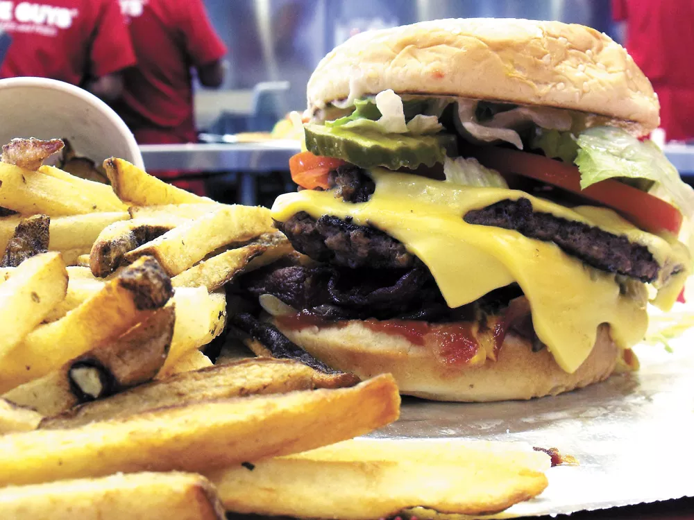 Our apologies to Carl's, Jr., but this is a six-dollar burger (actually $6.50), alongside Five Guys' non-frozen fries - HARLEY HIGHFILL