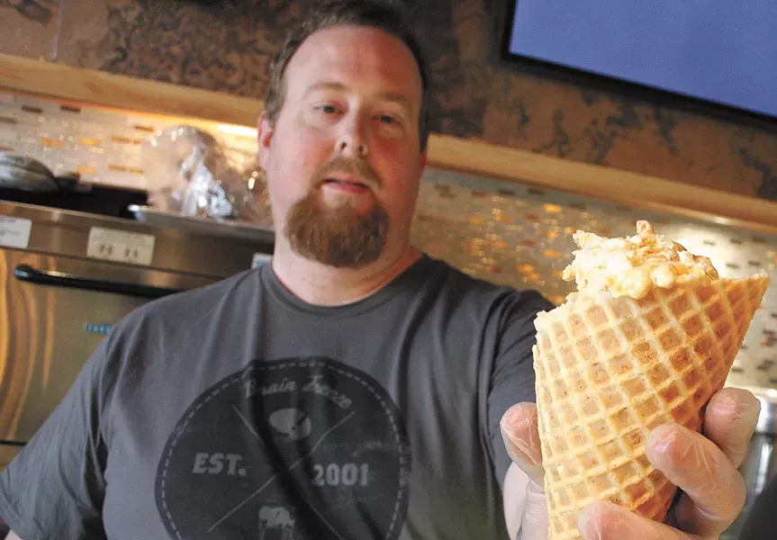 Owner Tom Purdum serves it up in Kendall Yards. - CHRIS BOVEY