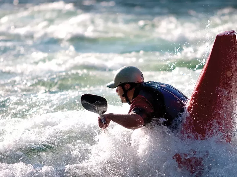 Paddling the "trailer park wave" on the Spokane River near Post Falls - GLEN LANDBERG