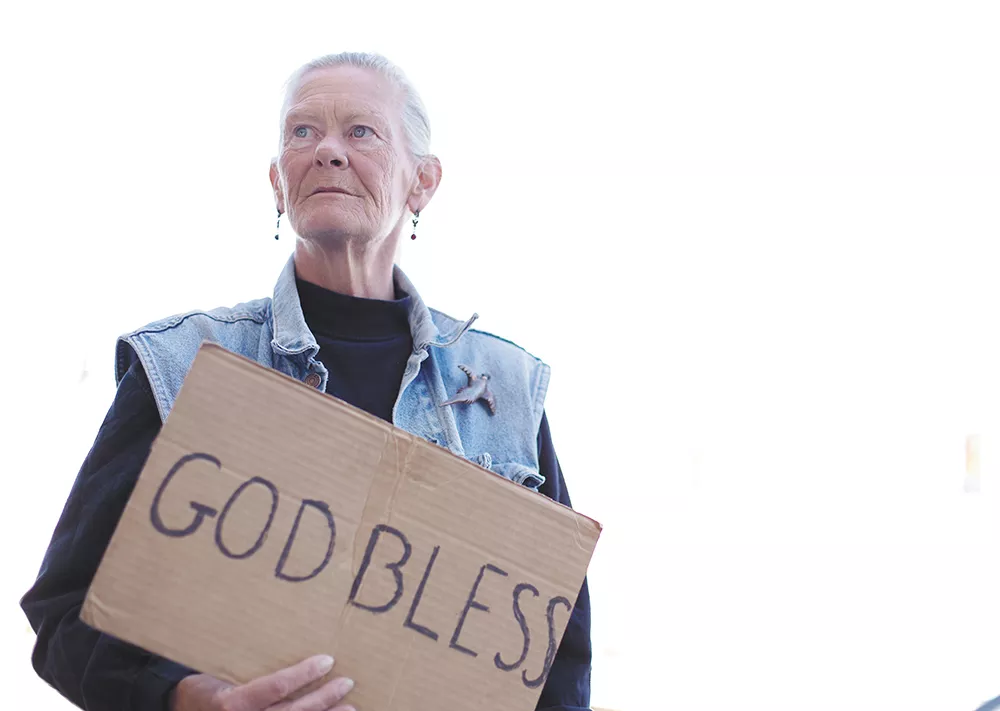 “Pepper,” as she goes by on the streets, is not homeless. She relies on money raised at Lincoln and Third to cover her living expenses; one passerby gave her a check for $720 — enough to cover a month’s rent. - YOUNG KWAK