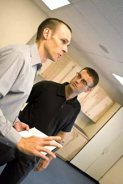 Principal Sean Dotson (right) and Mike Wiser, project manager, tour the future site of Sunset Elementarys new health clinic. - STEPHEN SCHLANGE