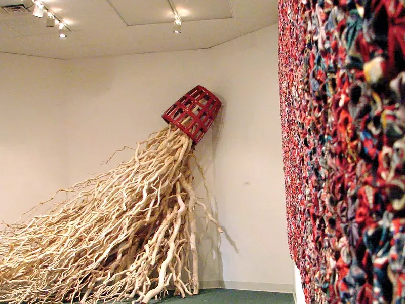 Ron and Kathryn Glowen’s “Tangle” (backround) and “Eden Red” (on wall).