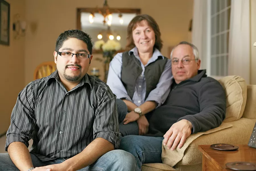Shane Baumgarten with his adopted parents, Theresa and Dennis - YOUNG KWAK