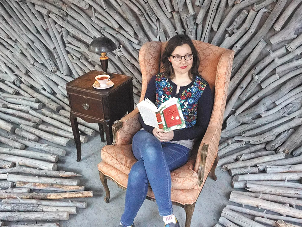 Sharma Shields sits in a window space inspired by her novel and designed by Richard Vander Wende and Kate Vita