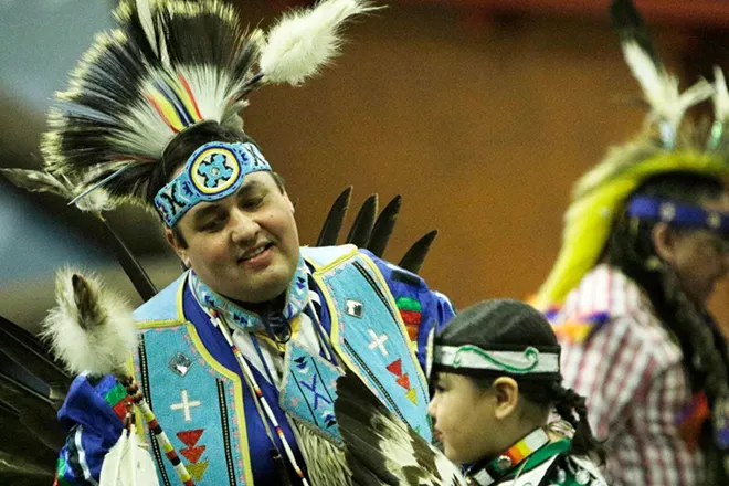 Shawn Decker, left, of the Salish and Spokane Tribes, left, and his 6-year-old son Brock dance. - YOUNG KWAK