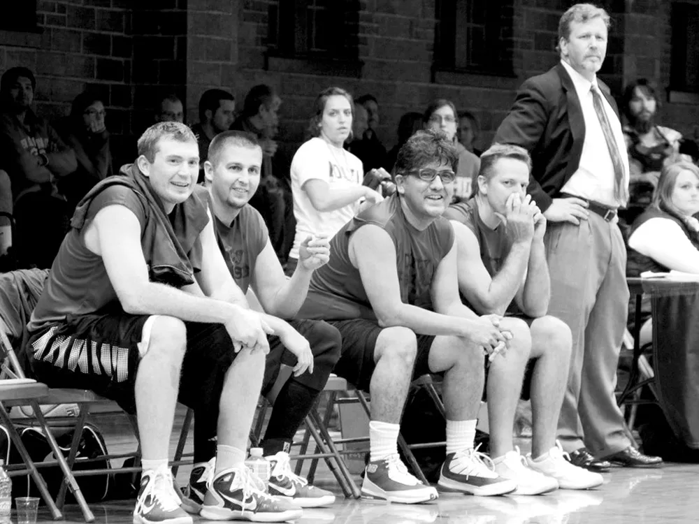 Sherman Alexie and Shann Ray (seated, third and fourth from left) team up with local basketball legends