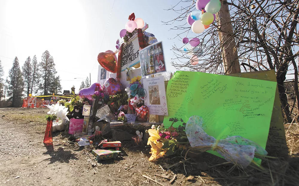 Sidewalk chalk, porcelain angels and stuffed animals — a few Stephanie Renee Meier's favorite things — are placed among flowers and notes left at the accident site. - YOUNG KWAK