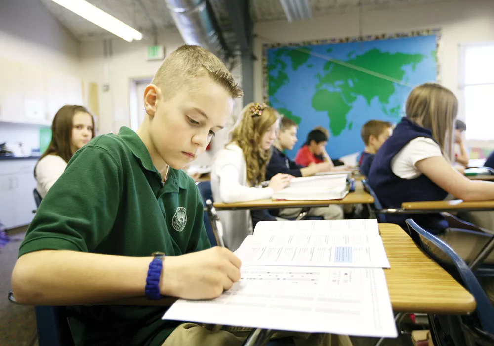 Sixth-grader Cameron takes a National Geography Bee exam during study lab at Coeur d\'Alene Charter Academy. - YOUNG KWAK
