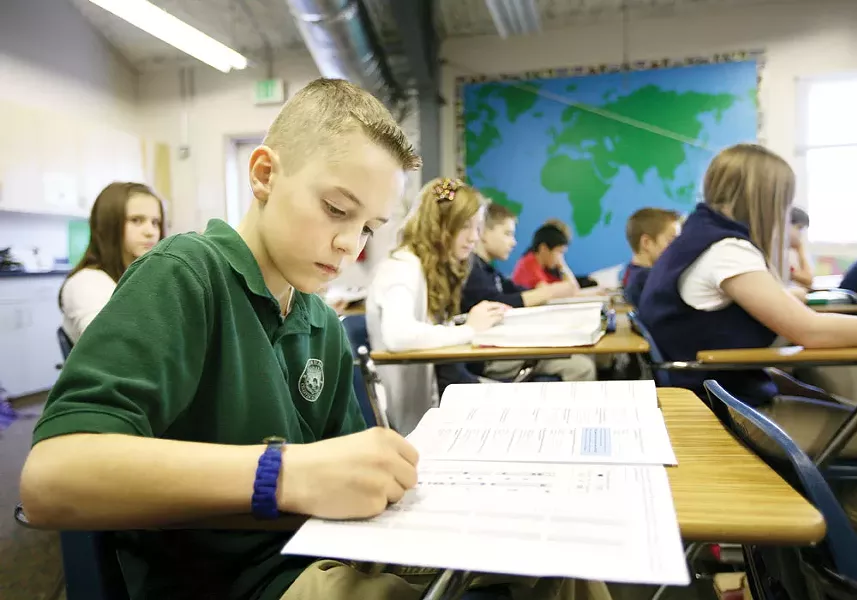 Sixth-grader Cameron takes a National Geography Bee exam during study lab at Coeur d\'Alene Charter Academy. - YOUNG KWAK