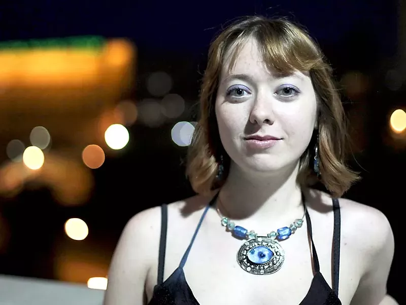 SlutWalk co-organizer Taylor Malone stands on the Monroe Street Bridge — one of the first stops along the route. - JORDAN BEAUCHAMP