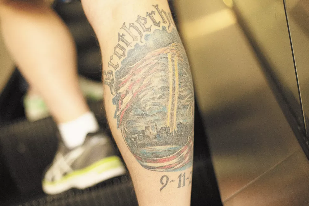 Spokane Fire Department Captain Roger Libby’s intricate - commemorative 9/11 tattoo on his right calf took three sessions and 20 hours to complete. - YOUNG KWAK