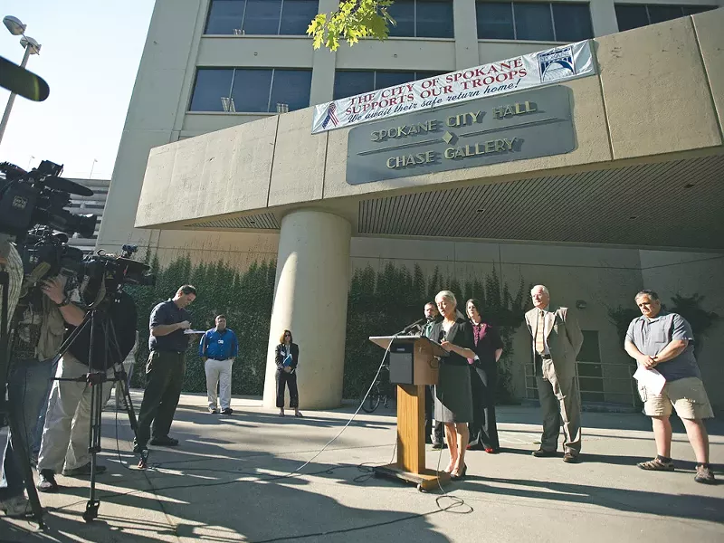 Spokane Mayor Mary Verner at a press briefing last week, flanked by City Council members and members of the press. - YOUNG KWAK