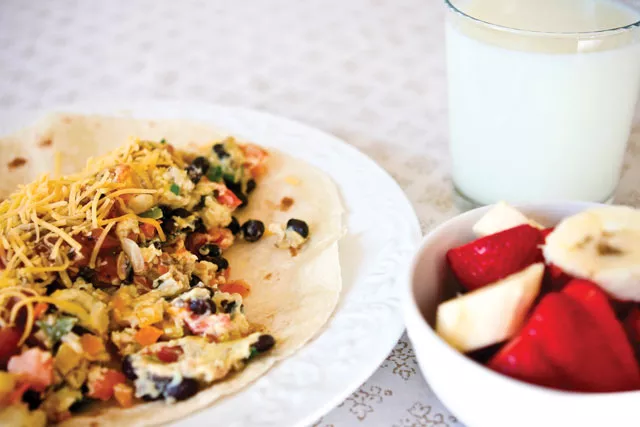 Spokane mom and Meatless Monday practitioner Michelle Sidles makes minus-the-meat look yummy with this breakfast burrito. - MICHELLE SIDLES