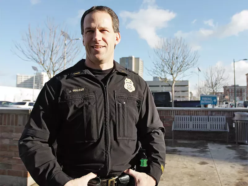 Spokane Police Lt. Joe Walker standing in front of the bench where the backpack bomb was left. - YOUNG KWAK