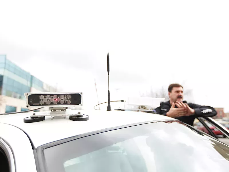 Spokane Police Officer Dan Cole has driven one of the department\'s two license-plate-scanner-equipped vehicles for about a year. - YOUNG KWAK