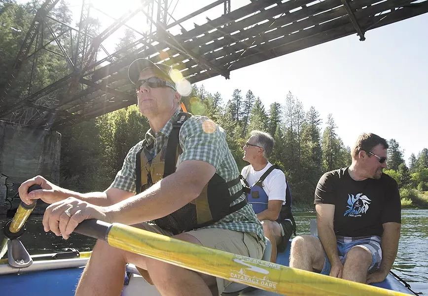 Spokane Riverkeeper Jerry White, left, often leads educational tours on the river. Spokane Utilities Director Rick Romero, center, and the Spokane Tribe’s Brian Crossley sit in back. - JACOB JONES