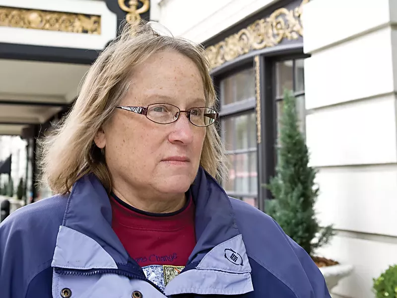 Susie Matteson stands in front of the Davenport Hotel, the epicenter of the Davenport Arts District. - STEPHEN SCHLANGE